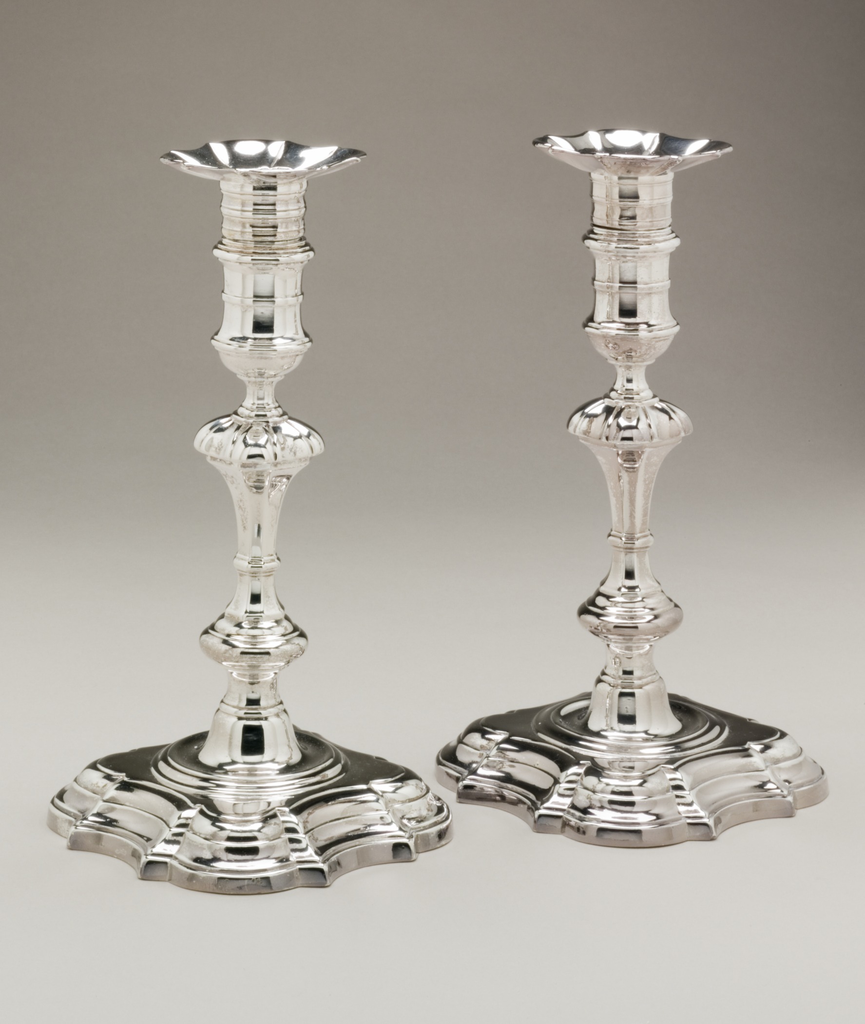 Pair of silver candlesticks by Paul de Lamerie